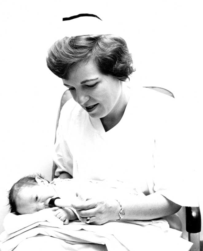 A nurse providing care for a baby with cleft palate.