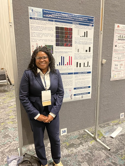 NIDCR-supported trainee Dr. Brianyell McDaniel Mims presents at NIDCR’s trainee poster session.