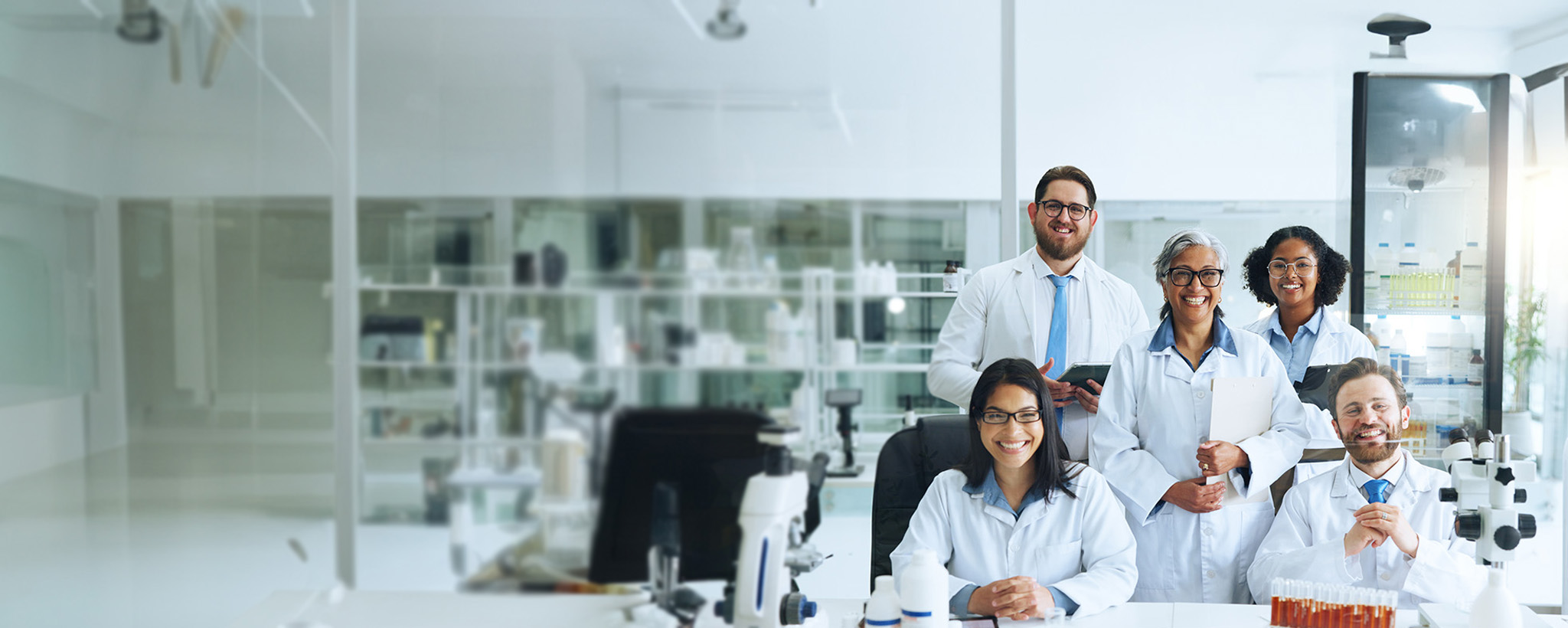 Five researchers smiling 