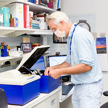 Dr. Burbelo is working in the lab.