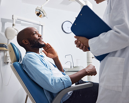 A man talks to his dentist.
