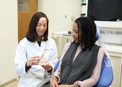 Dentist with patient