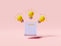 Yellow light bulbs surrounding a book.