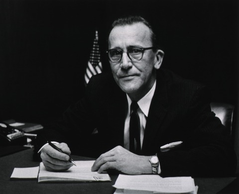 Francis Arnold signing documents. 
