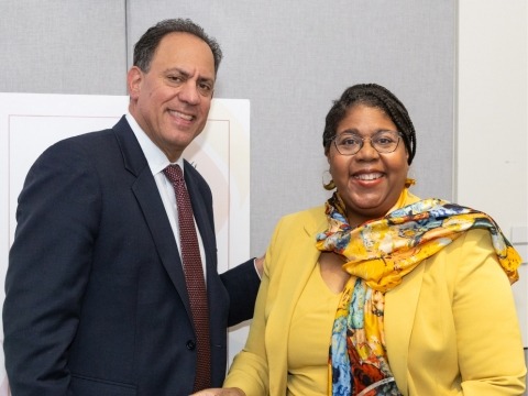 A photo of Dr. Webster-Cyriaque receiving the Excellence in Research Award from the Shils Entrepreneurial Fund