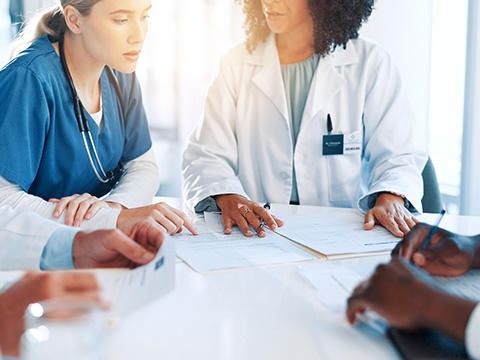 Doctors sitting and talking to each other