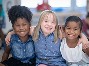 Children smiling and looking at the camera