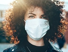 Woman wearing a face mask outside