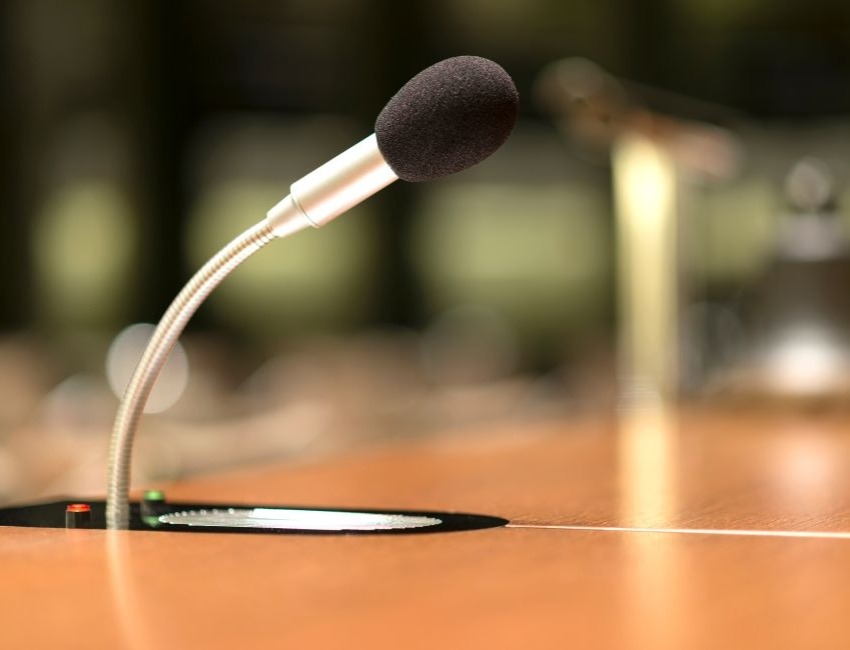 A close-up of a microphone on a desk