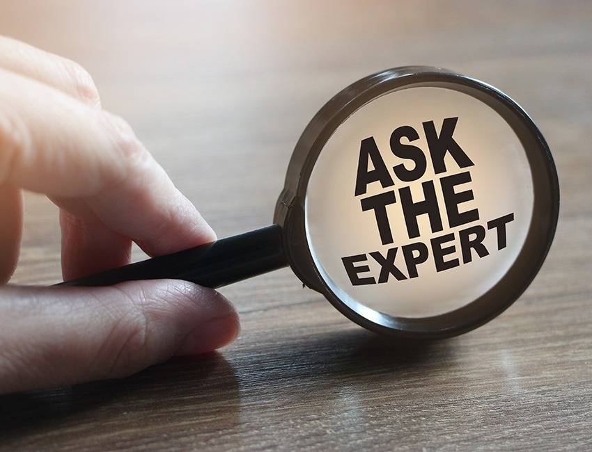 Magnifying glass with the words "Ask the Expert" inside of it