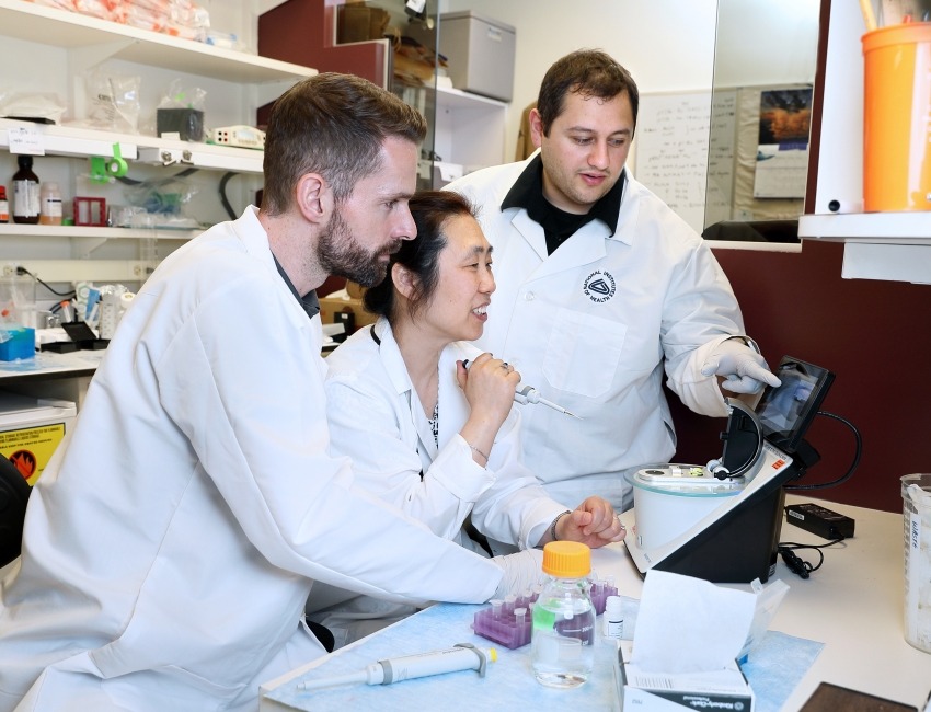researchers collaborating in the lab
