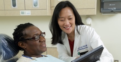 Dr. Janice Lee with a patient in the dental clinic