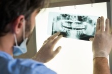 Dentist viewing x-ray 