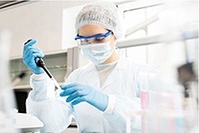 Lab technician working in a lab.