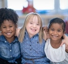 Children smiling and looking at the camera