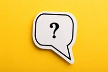 A stock image depicting a question mark within a speech bubble.