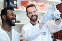 Two NIDCR researchers working in the lab.