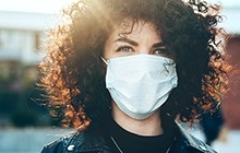 Woman wearing a face mask outside