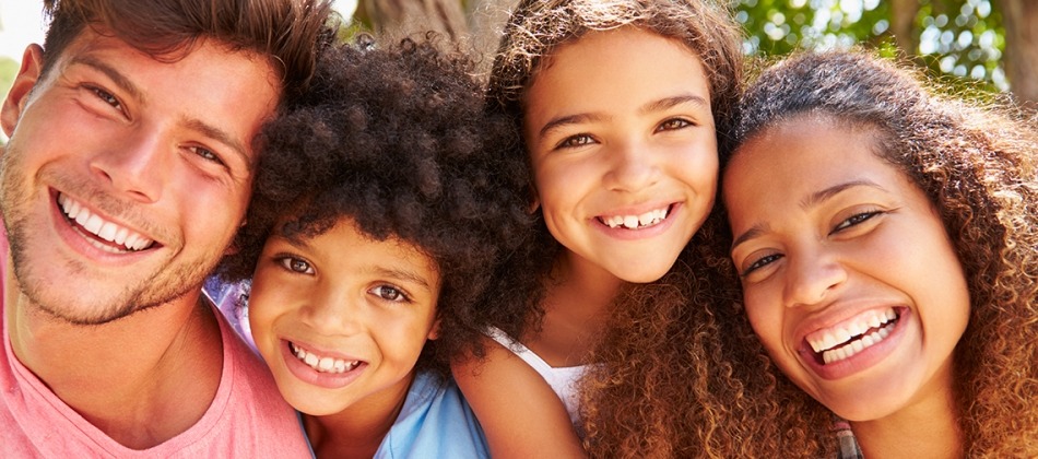 Family smiling at the camera