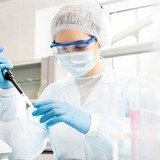 Researcher in lab wearing mask